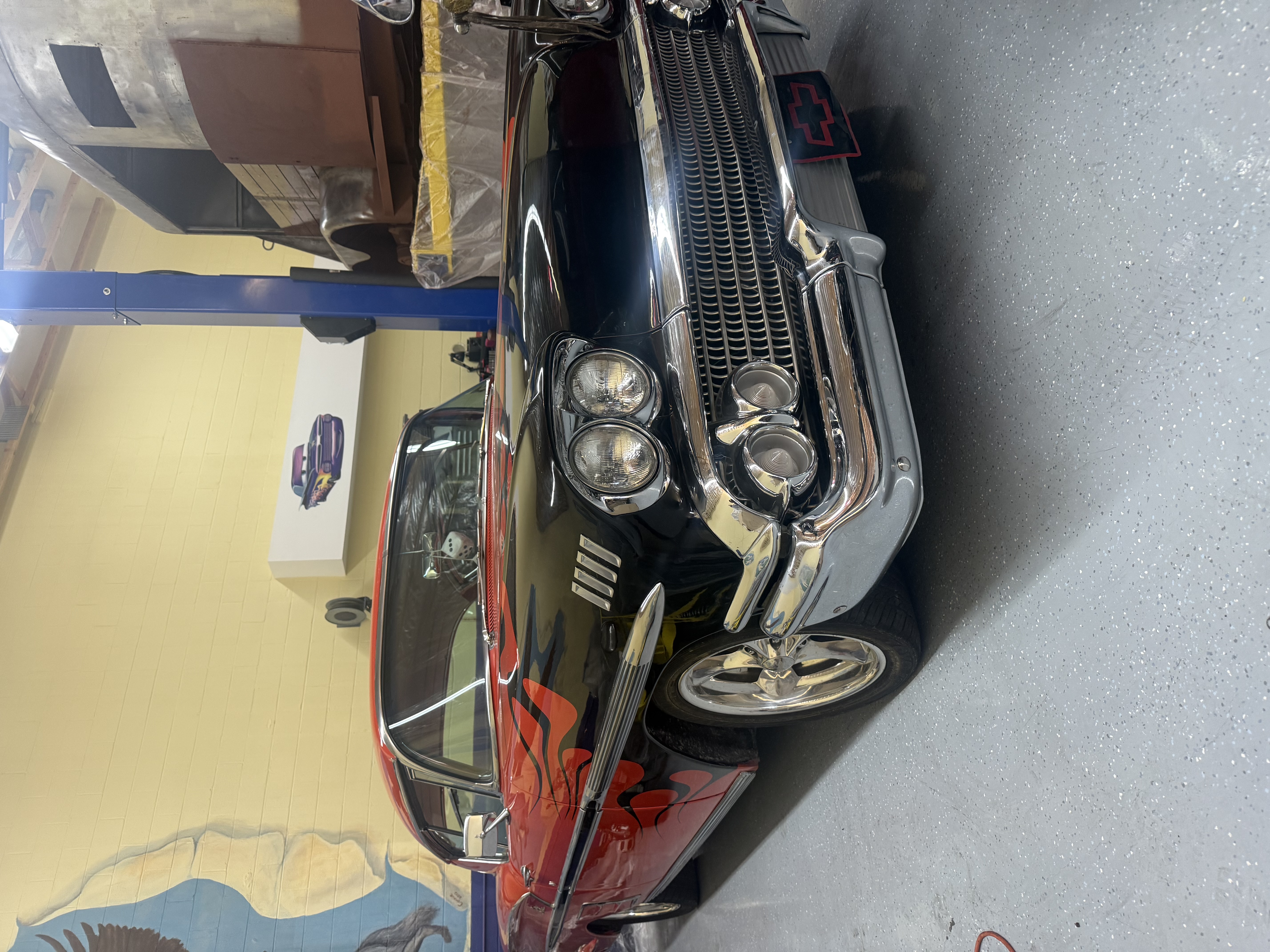 Low angle front view of a highly polished black classic car
