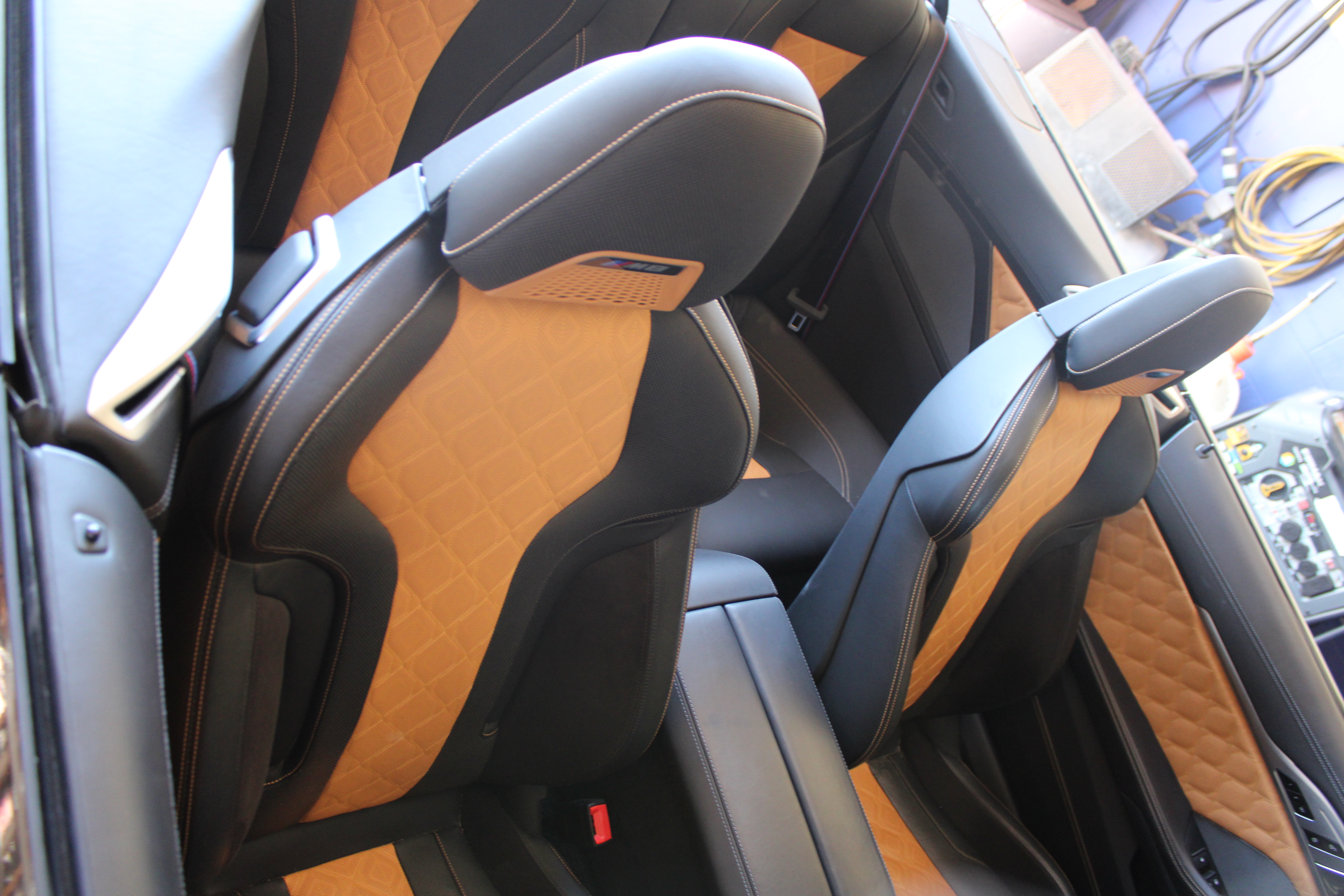 Detailed view of red and white classic car interior with dice